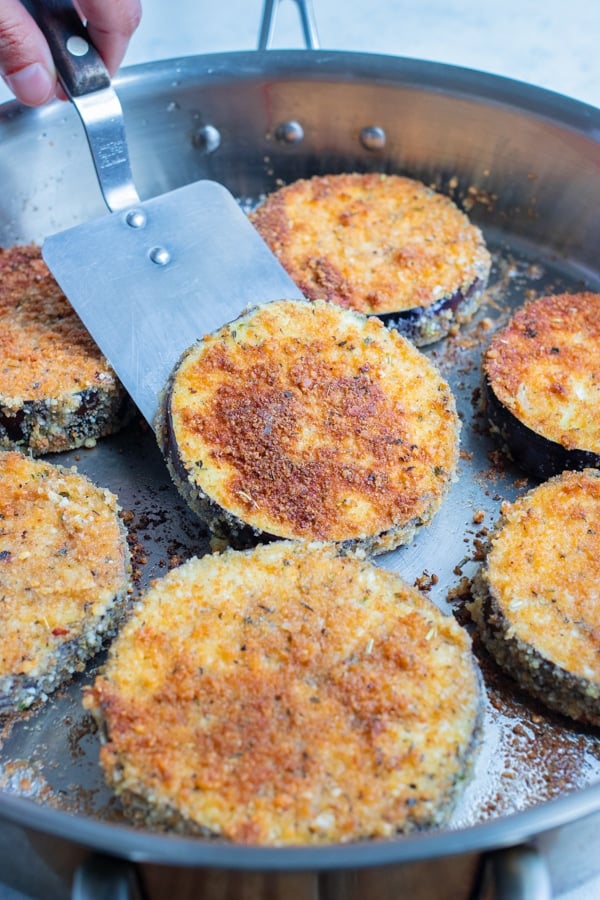 The eggplant slices are pan seared.