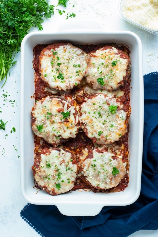 Vegetarian eggplant parmesan is served for a healthy dinner option.