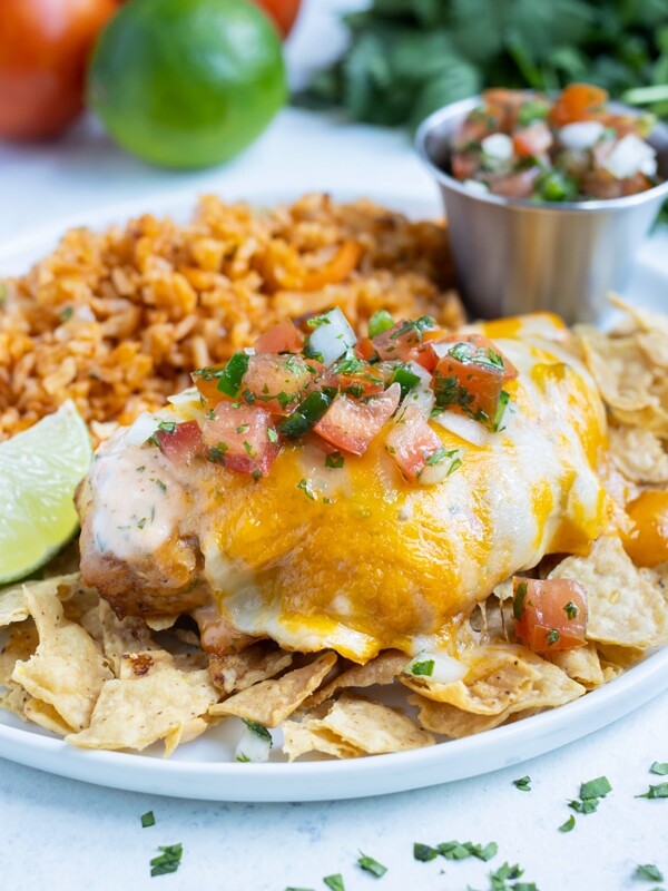 Fiesta lime chicken is placed on top of tortilla chips.