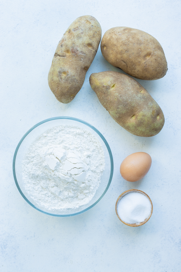Potatoes, egg, salt, and flour are the ingredients for making gnocchi.