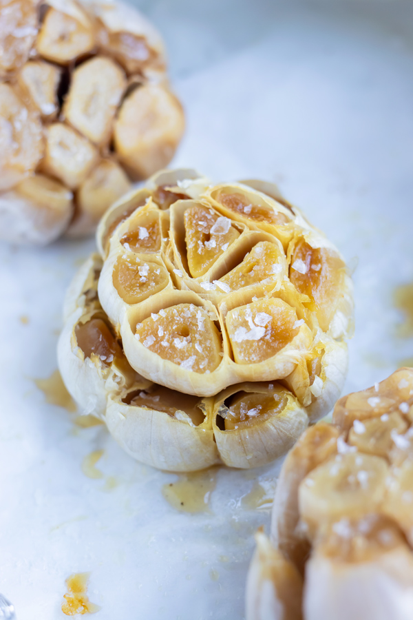 Salted, roasted garlic is shown full of rich flavor.