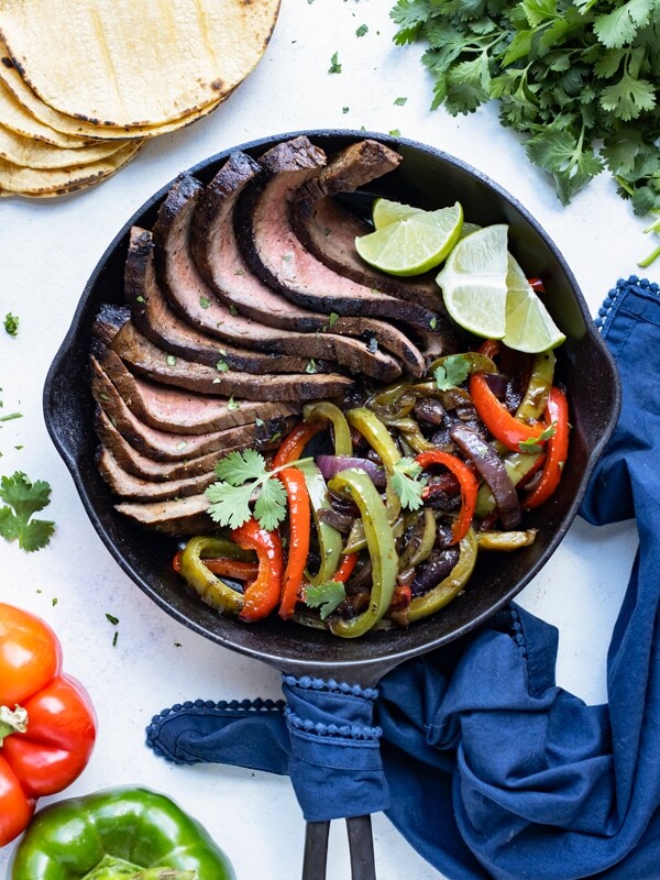 Flank steak fajita is served for a low-carb dinner recipe.