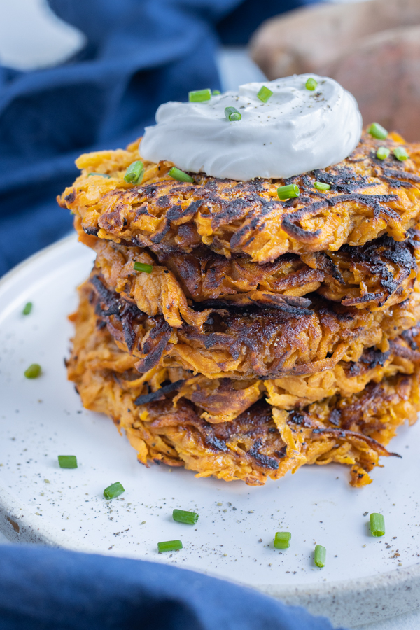 Easy and crispy sweet potato hash browns are served for a brunch side dish.