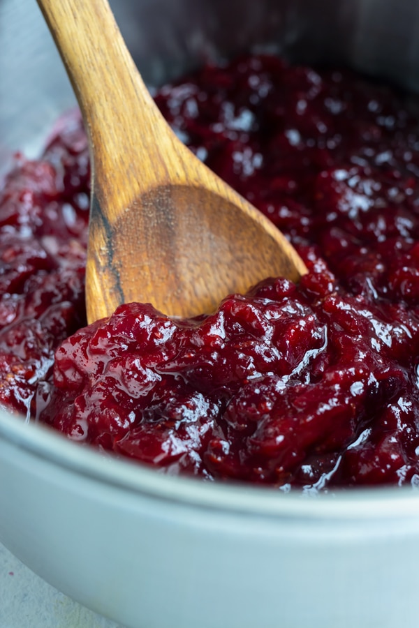 Fresh cranberry sauce is made on the stove.