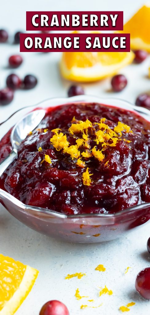 A bowl of fresh cranberry orange sauce is topped with fresh orange zest.