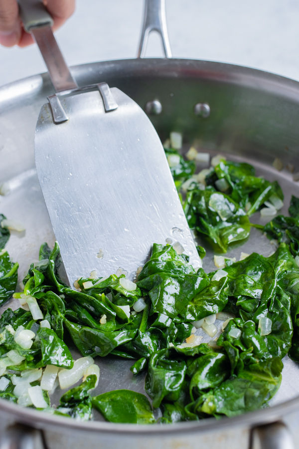 The spinach is sautéed for a healthy side dish.