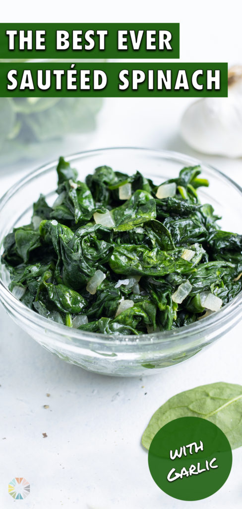 A glass bowl is filled with sautéed spinach.