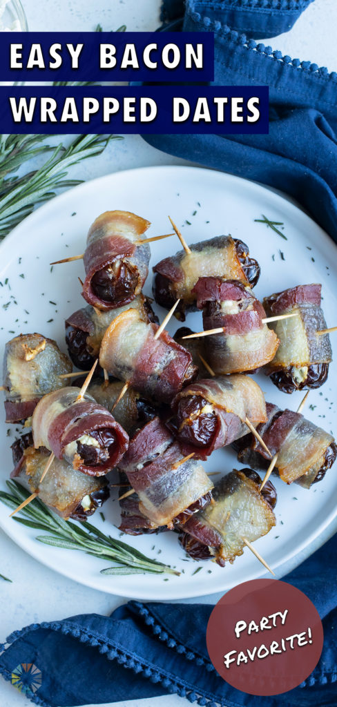 Date with goat cheese are wrapped in bacon and served on a plate.