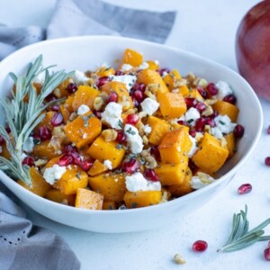 Butternut squash, goat cheese, and pomegranate are served for a holiday recipe.