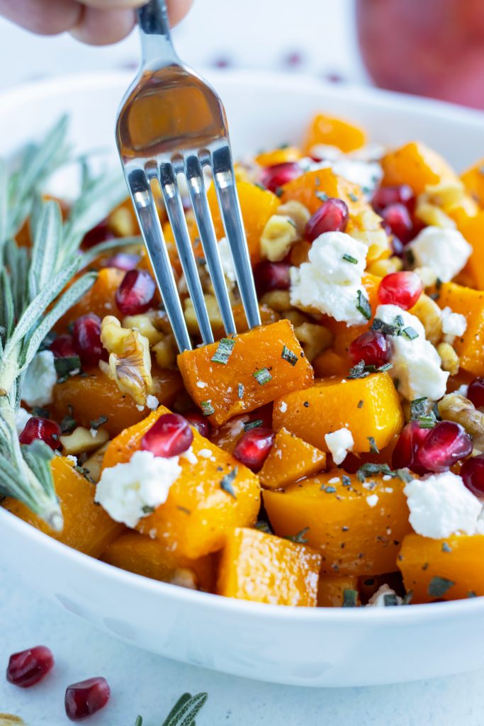 A fork is used to enjoy this butternut squash side.