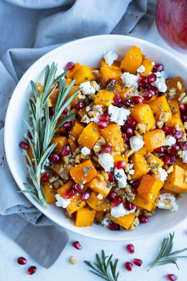 An overhead shot is used to show a bowl of butternut squash and goat cheese.