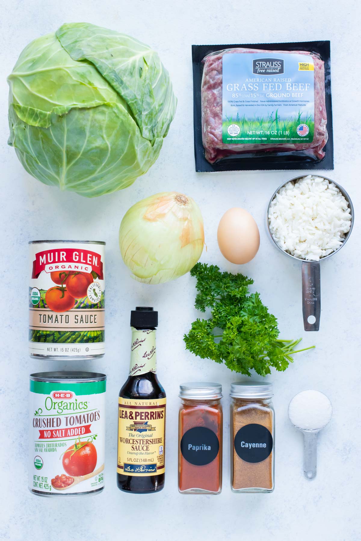 Cabbage, ground meat, rice, egg, tomatoes, spices, sugar, and Worcestershire Sauce are the ingredients.