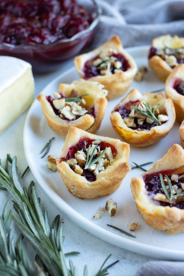 A plate of cranberry brie bites are served for a Thanksgiving appetizer.
