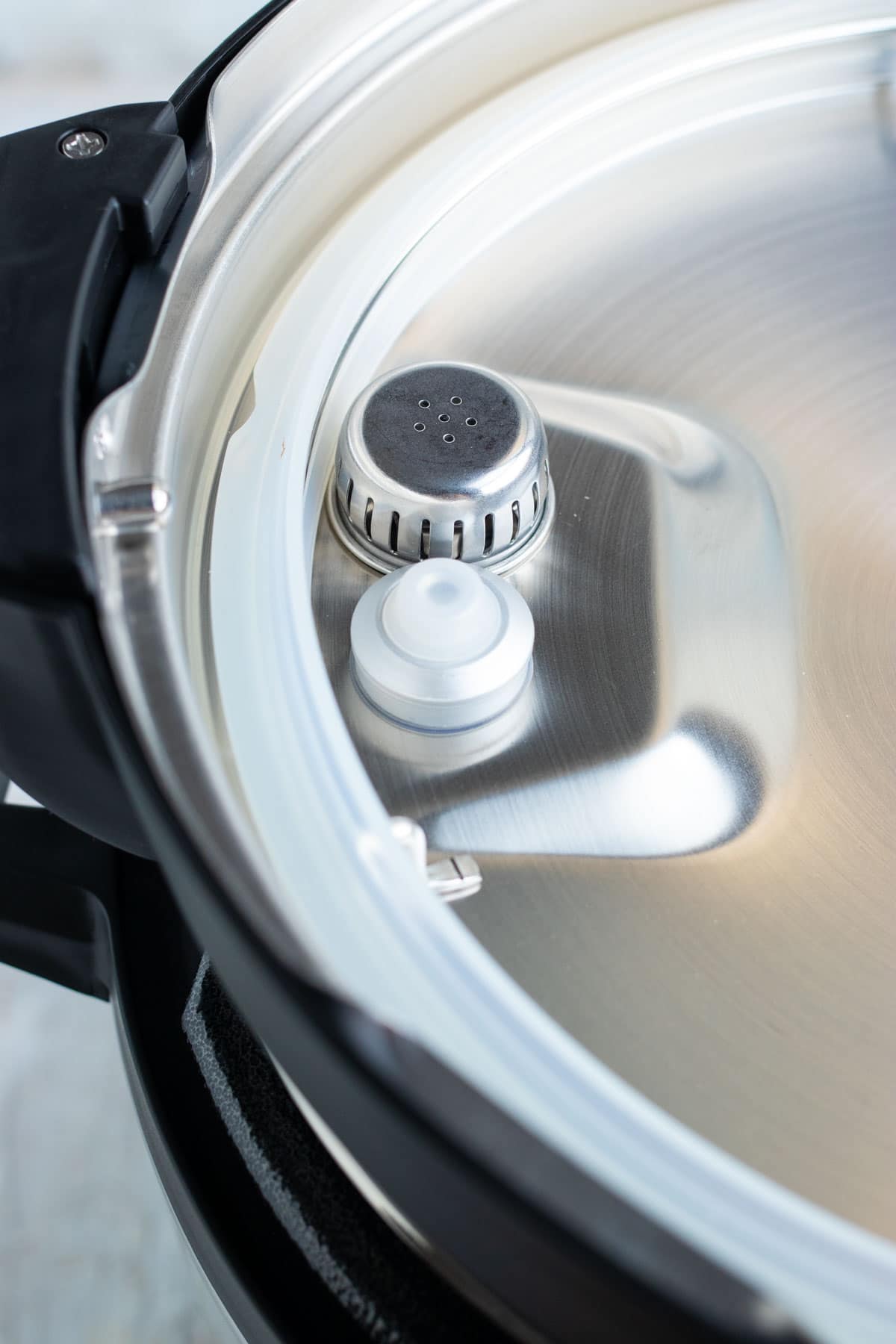 An image showing the anti-block shield of a pressure cooker.