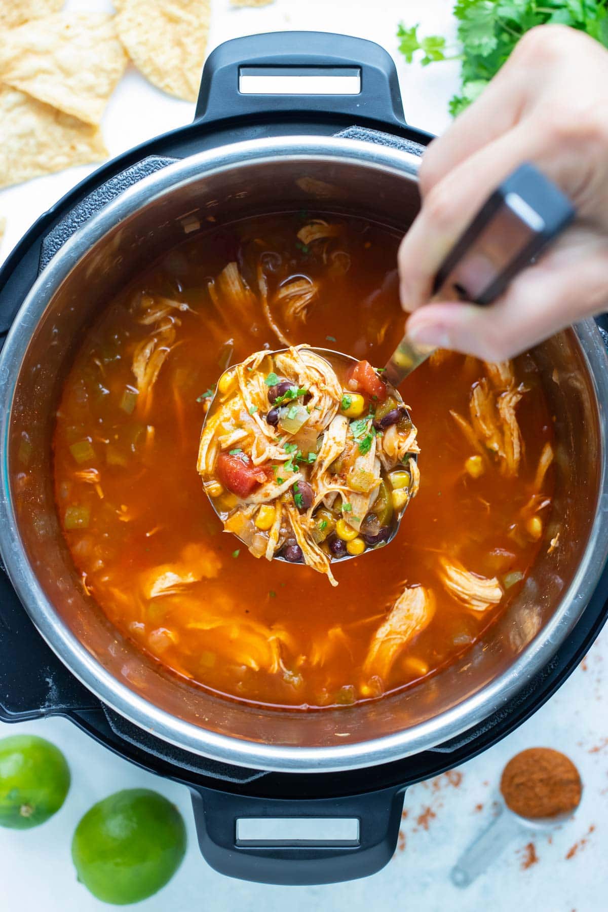 Healthy Mexican chicken tortilla soup is made in a pressure cooker for an easy dinner.