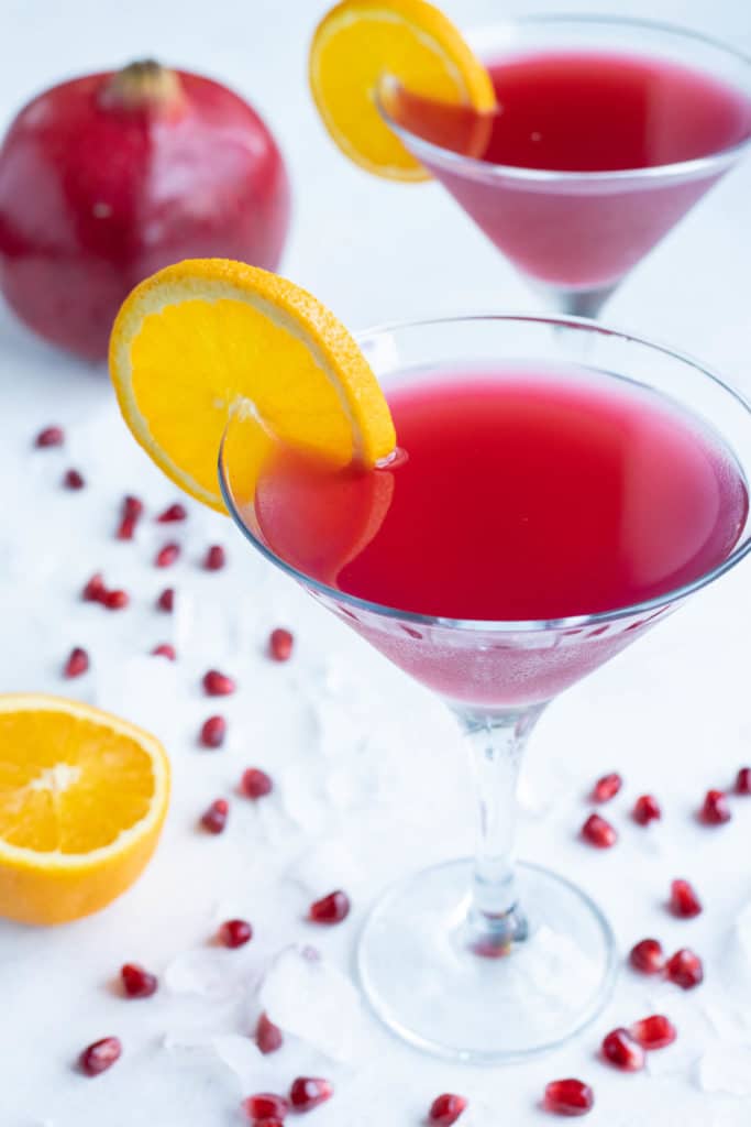 Pomegranate cocktails are shown on the counter.
