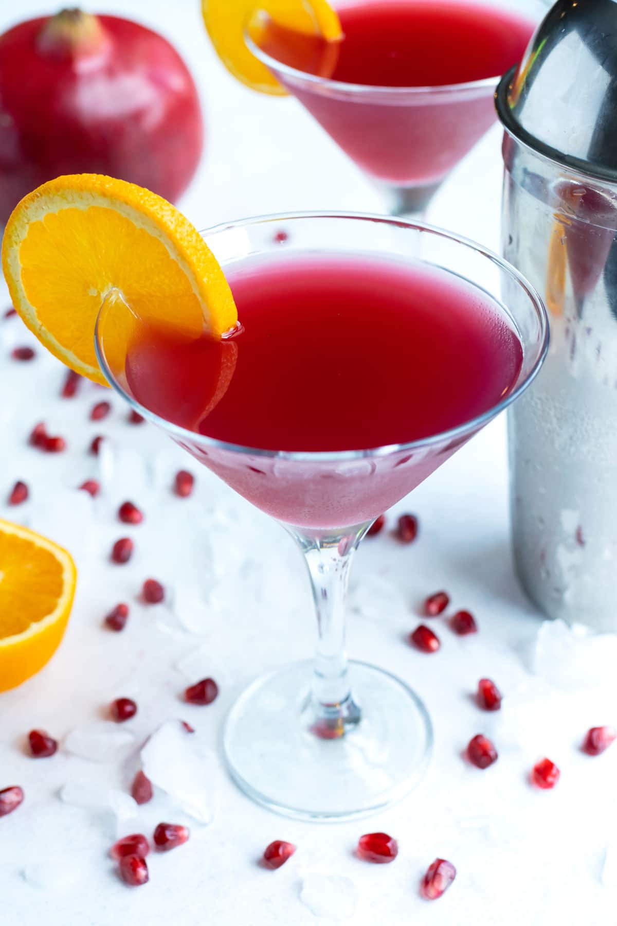 Fancy holiday cocktails are served for a party on the counter.