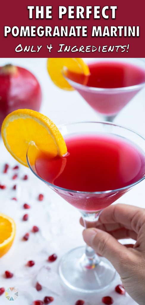 A hand is shown holding the Pomegranate Martini.