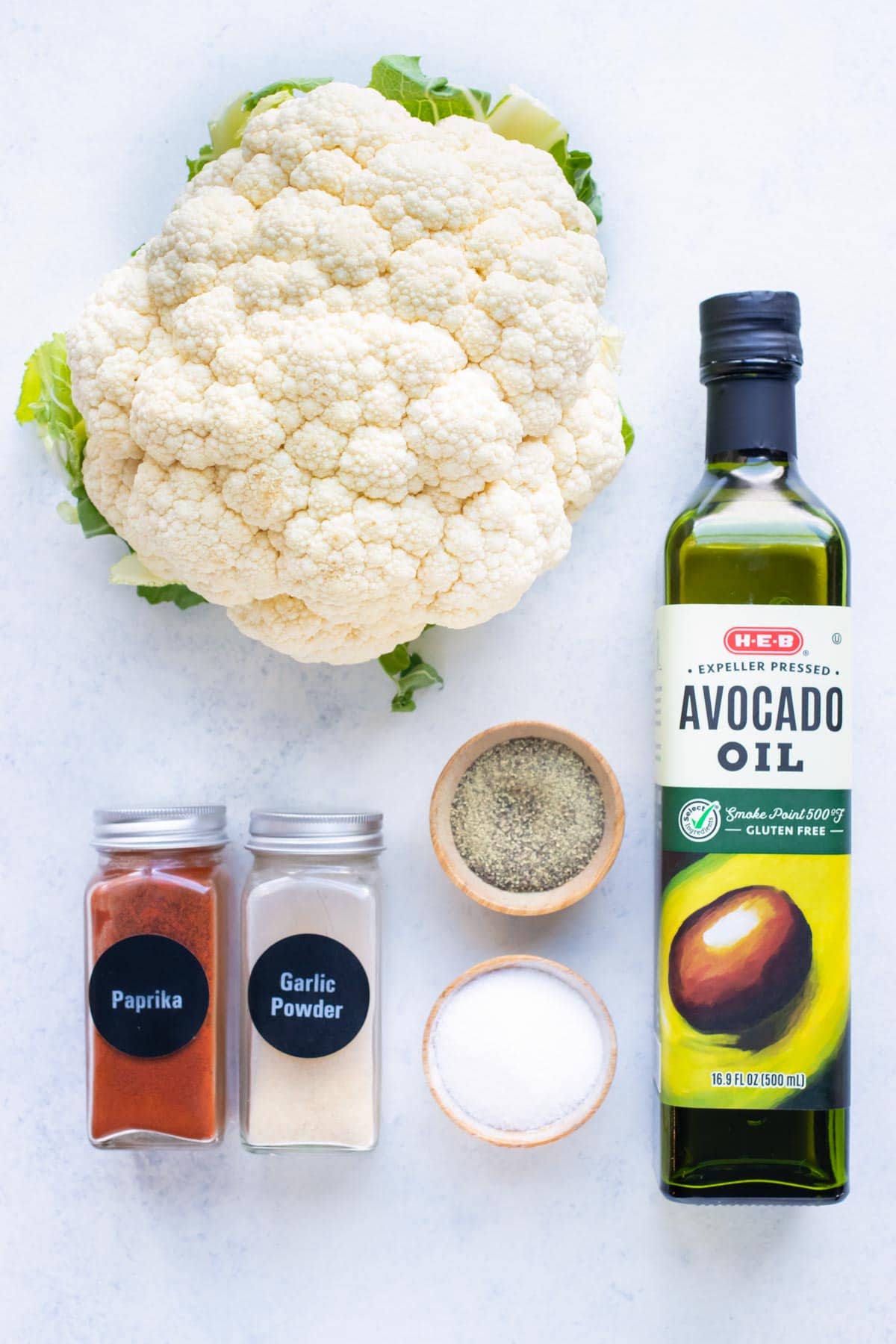 Avocado oil, cauliflower, and seasonings are the ingredients needed for this air fryer cauliflower recipe.