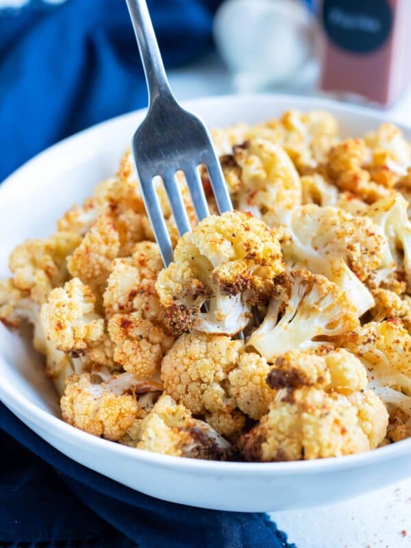 Low-carb air fryer cauliflower is eaten with a fork.