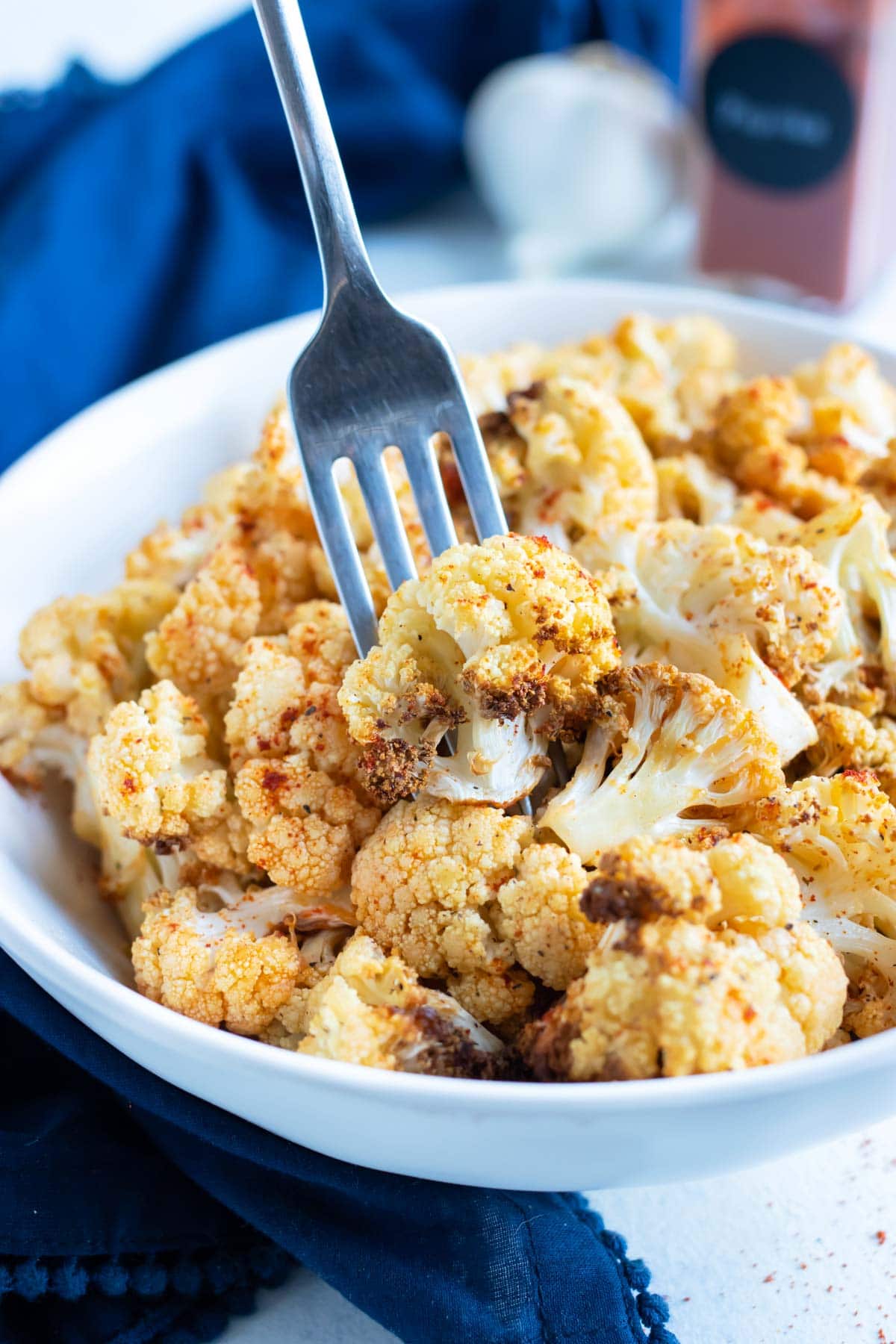 Low-carb air fryer cauliflower is eaten with a fork.