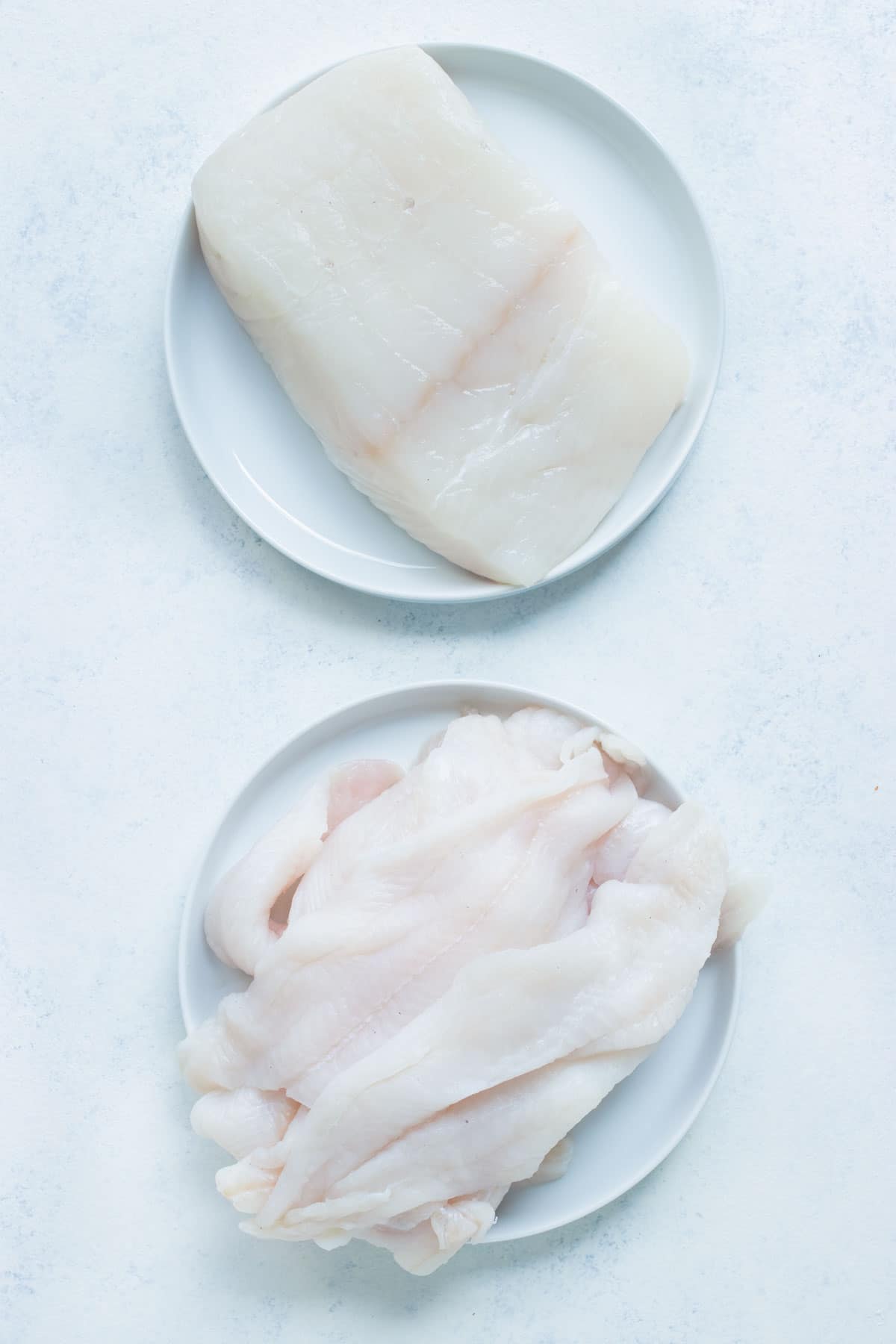 Cod fillets and other types of white fish are shown for this recipe.