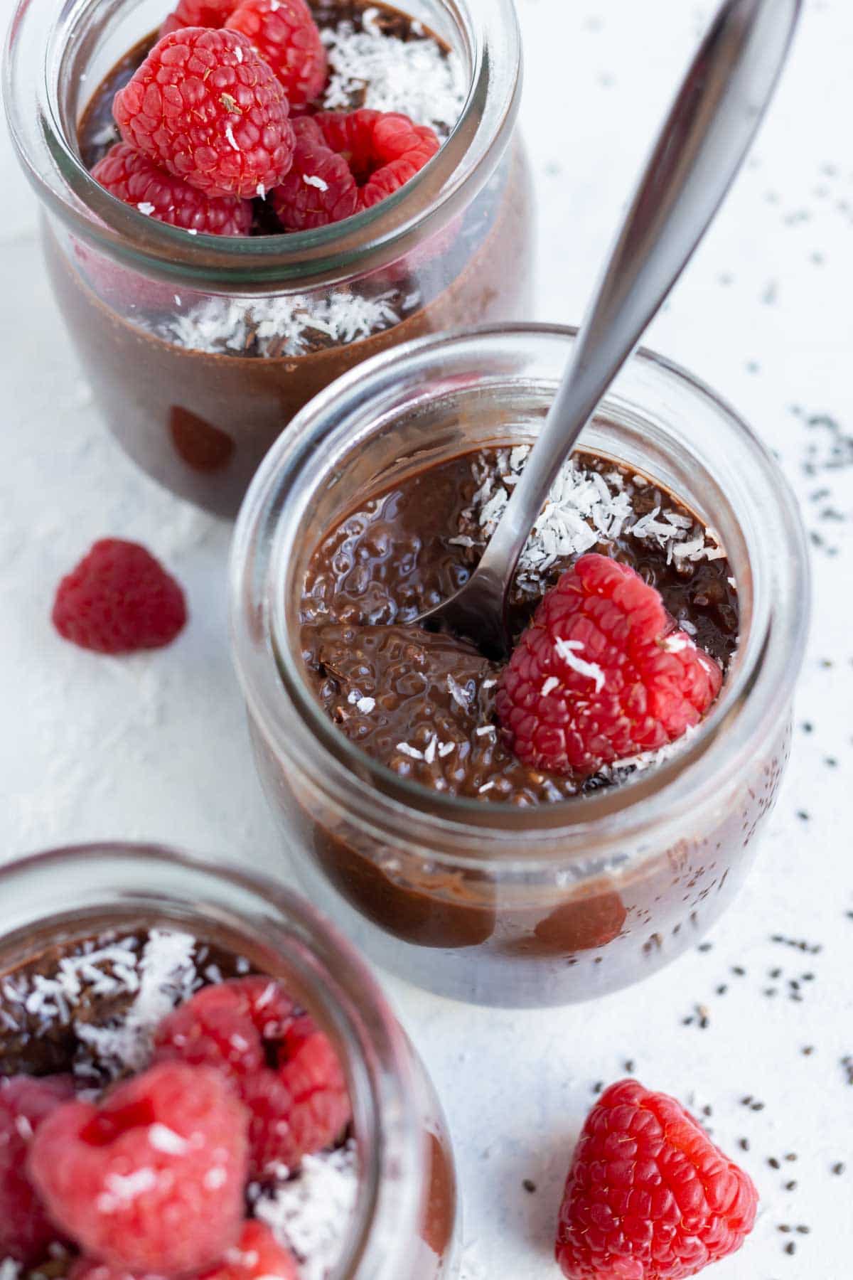 Creamy chocolate chia seed pudding is show from overhead.