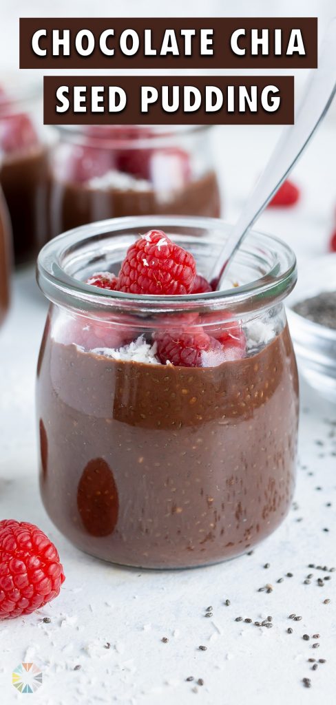 Raspberries are put on top of chocolate chia seed pudding.
