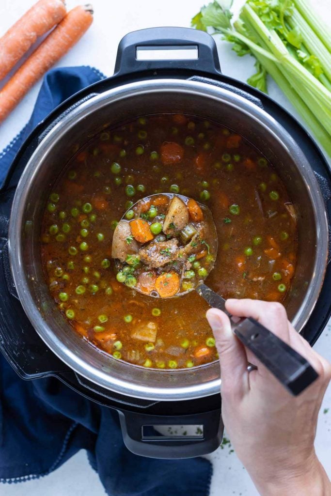 An overhead shot is used to show the instant pot filled with beef stew.