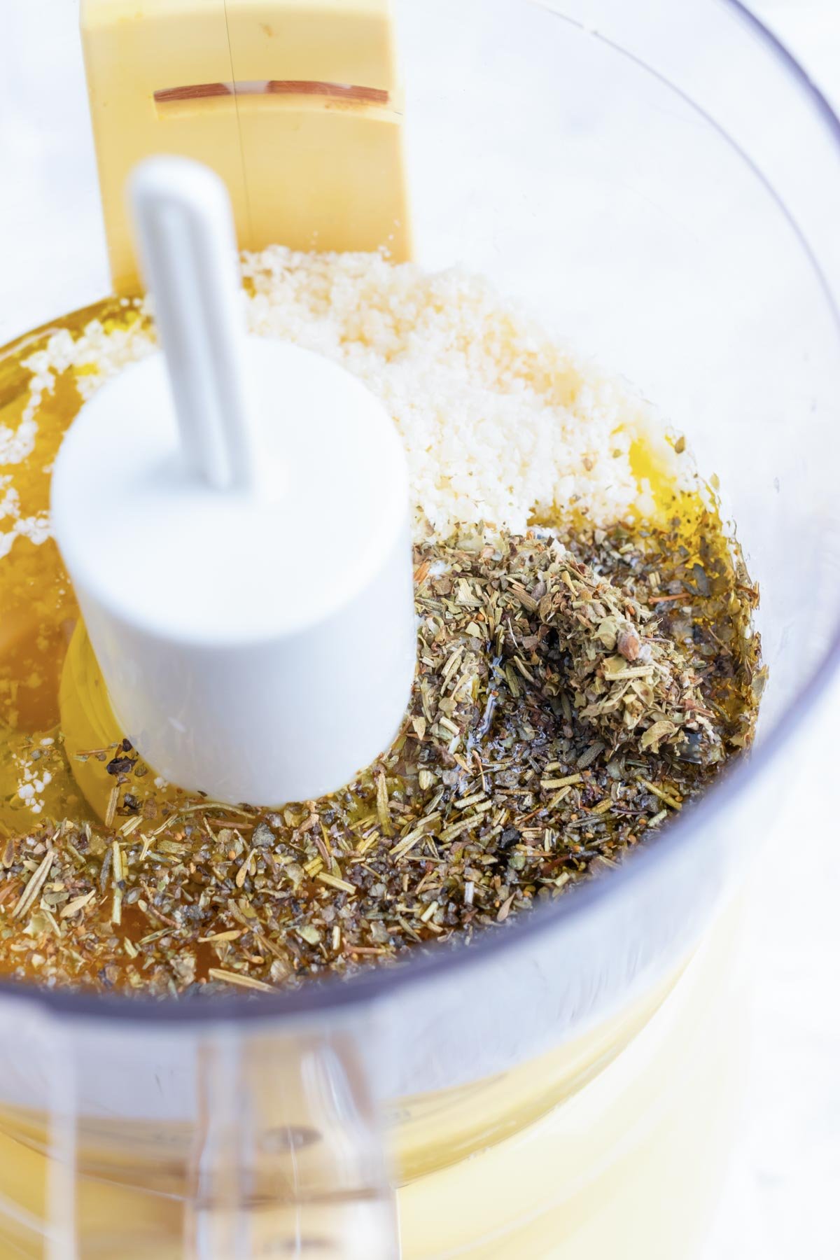 Homemade Italian salad dressing ingredients in a food processor.