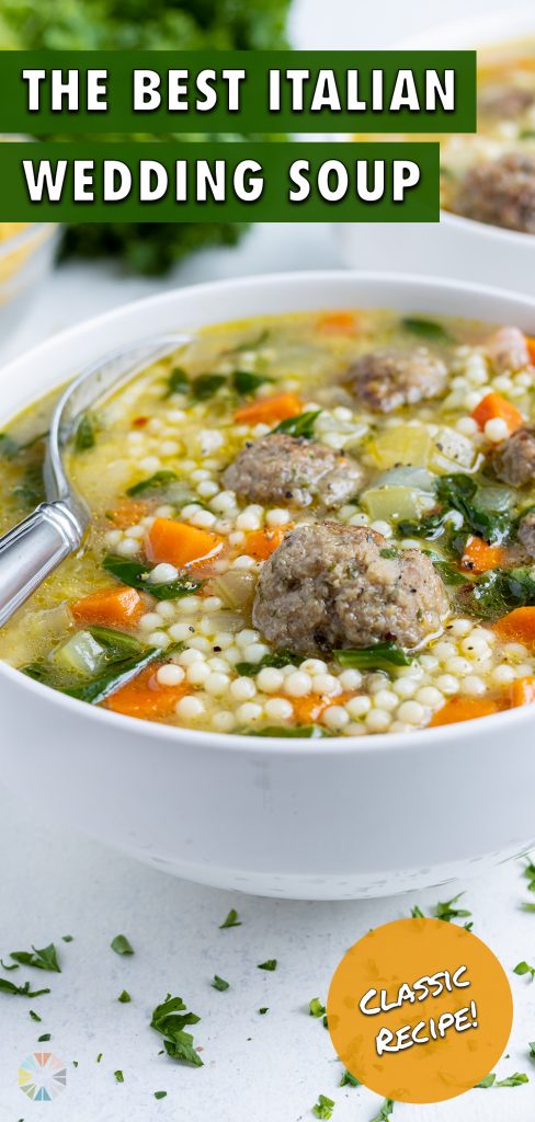 A metal spoon is shown in a bowl of healthy Italian wedding soup.