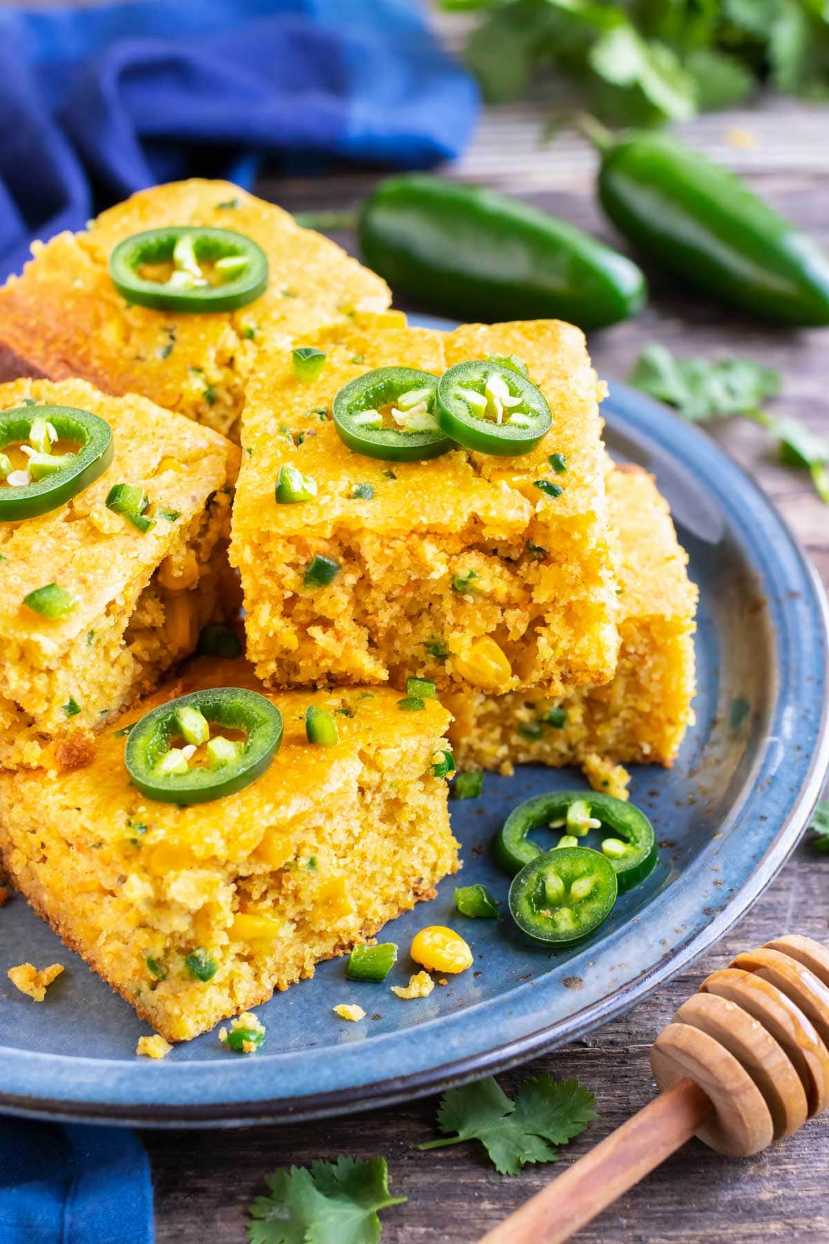 A stack of jalapeño cornbread on a blue plate.