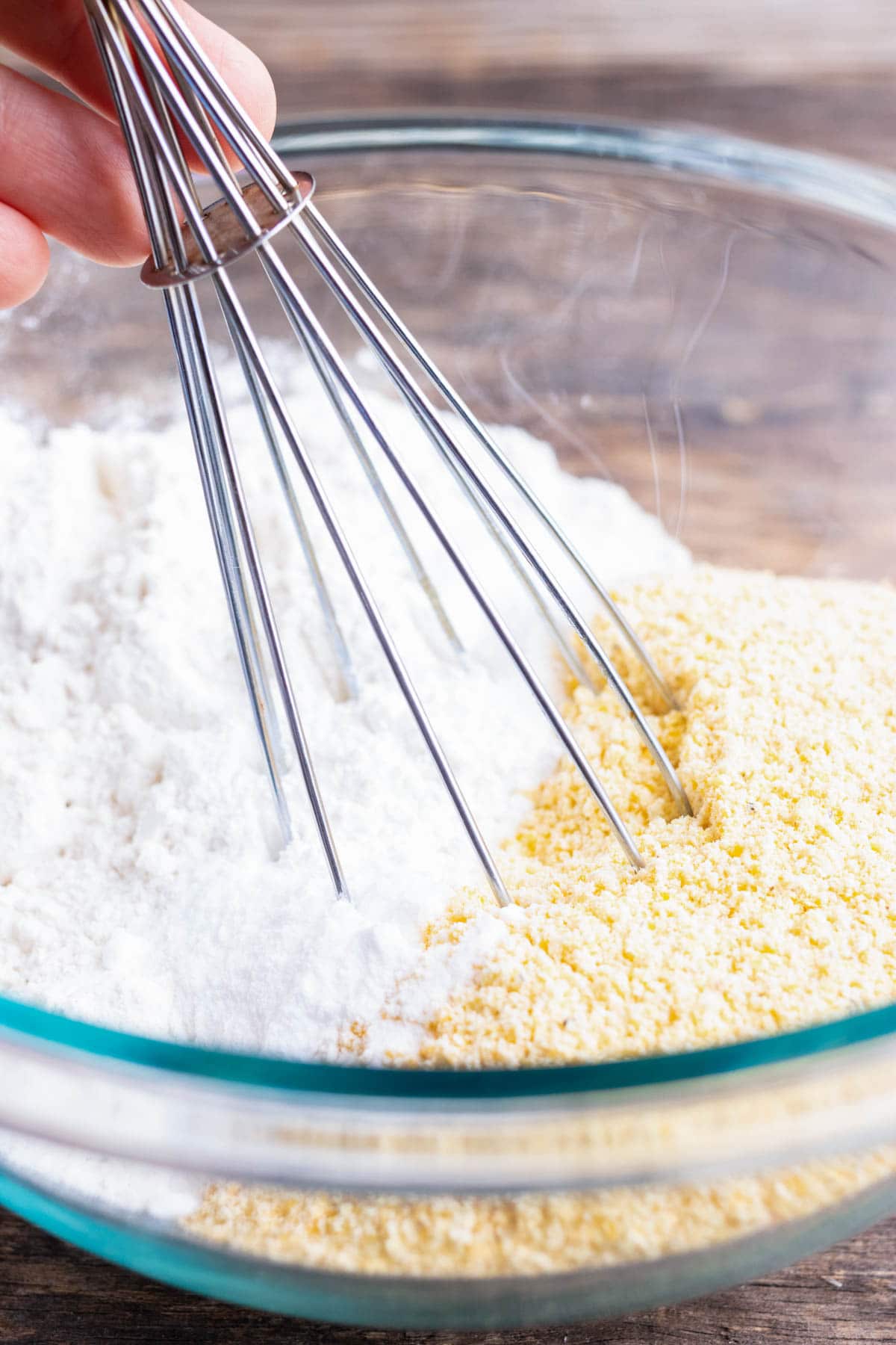 Dry ingredients being whisked together.