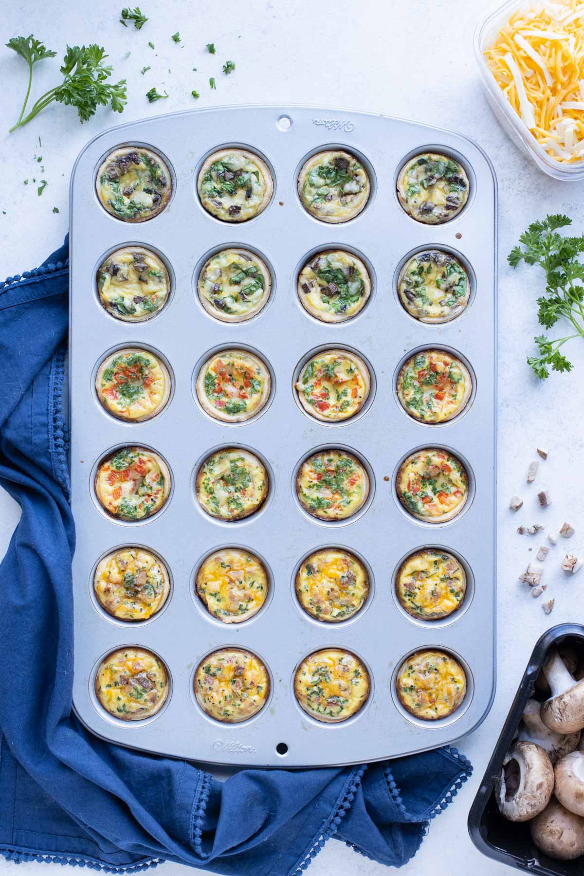 Mini quiches are baked in the oven until fluffy.