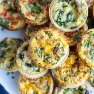 Mini quiche are shown on a plate for an easy appetizer recipe.