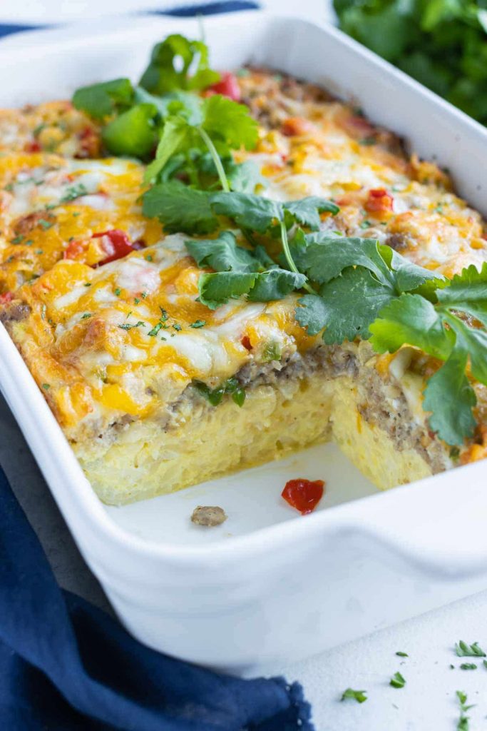 Breakfast casserole is shown with a serving missing.
