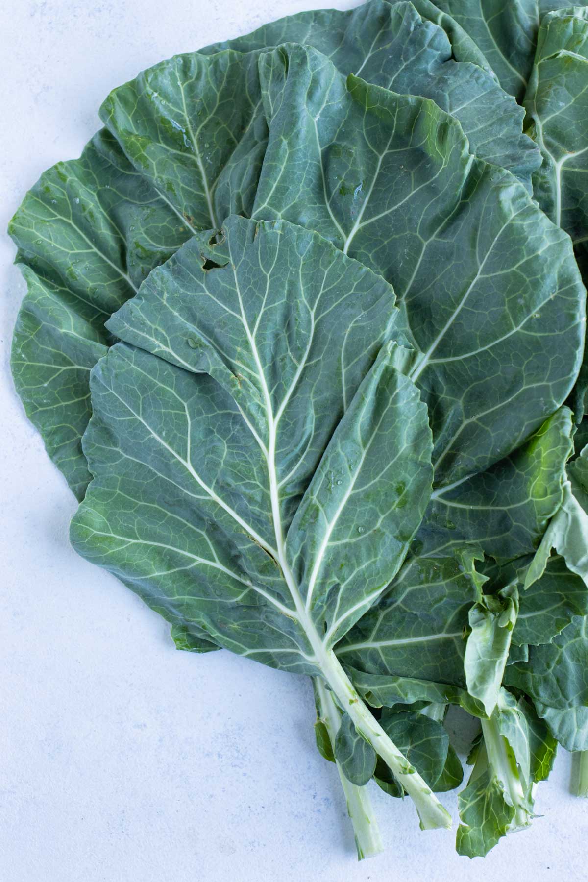 Fresh collard greens are shown on the counter.