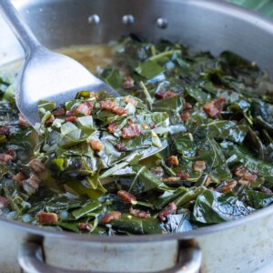 A pan is shown filled with cooked collard greens.