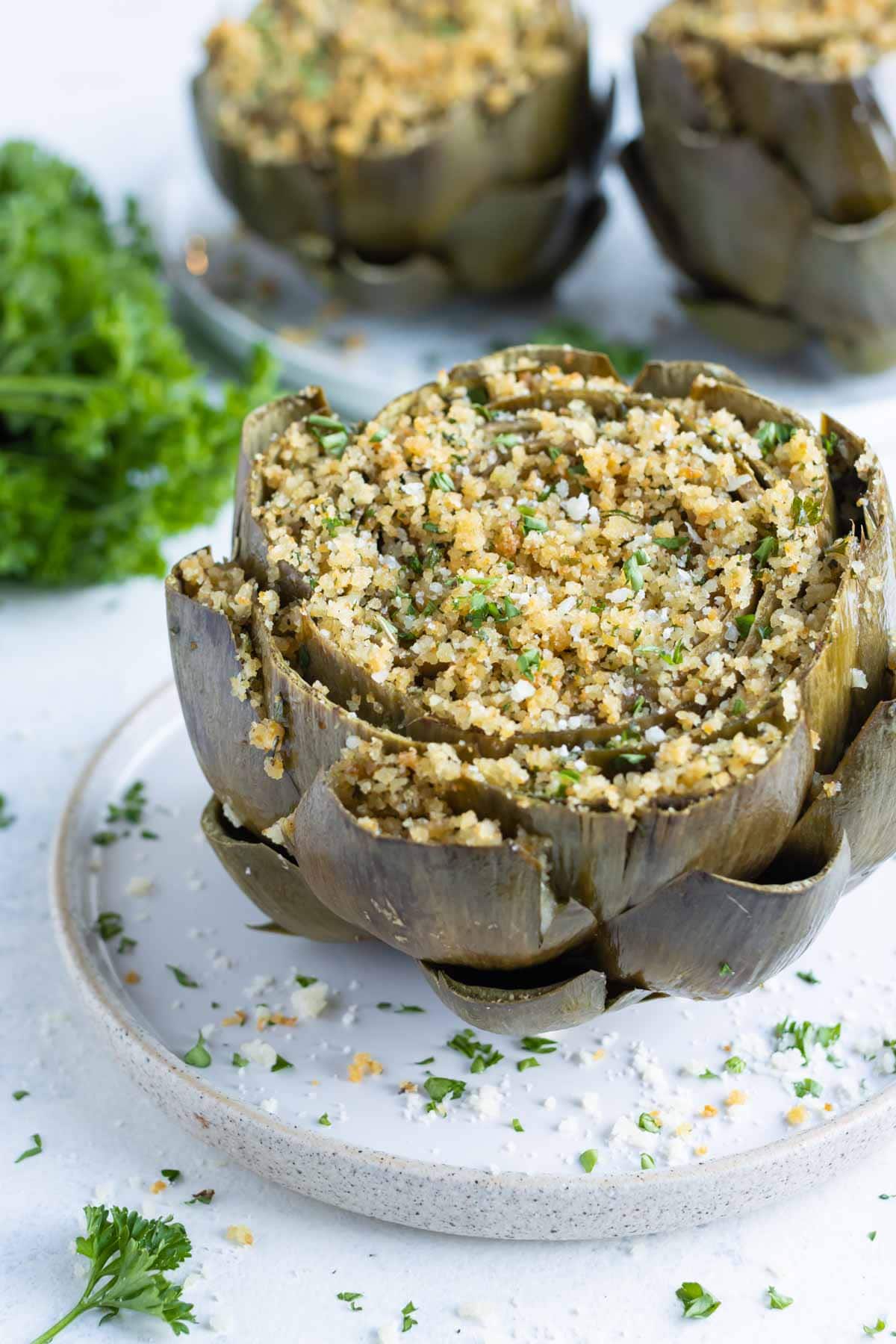 Artichokes are stuffed with Parmesan, parsley, and breadcrumbs.