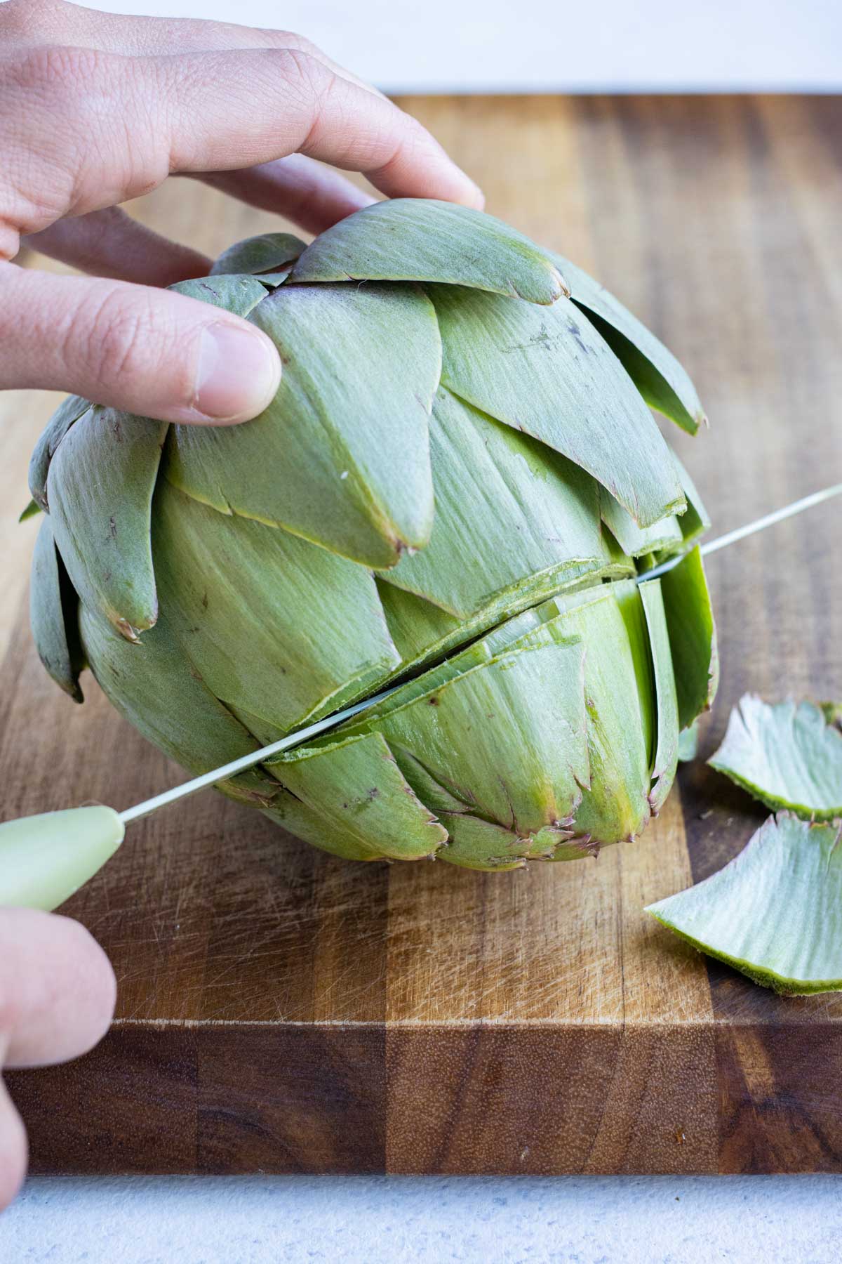 The top is cut off the artichoke for this recipe.