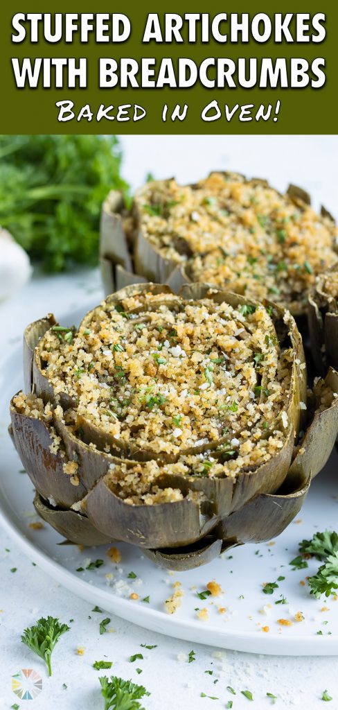 Three stuffed artichokes are plated for a healthy side.