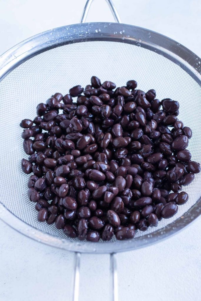 Black beans rinsed in a colander for Texas Caviar.