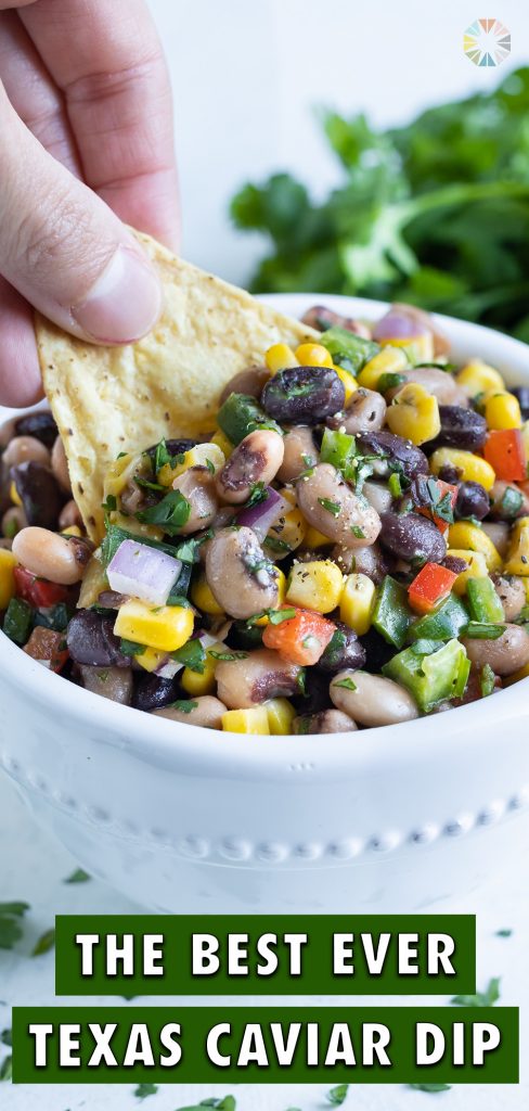A chip is dipped into the Texas caviar for an appetizer.