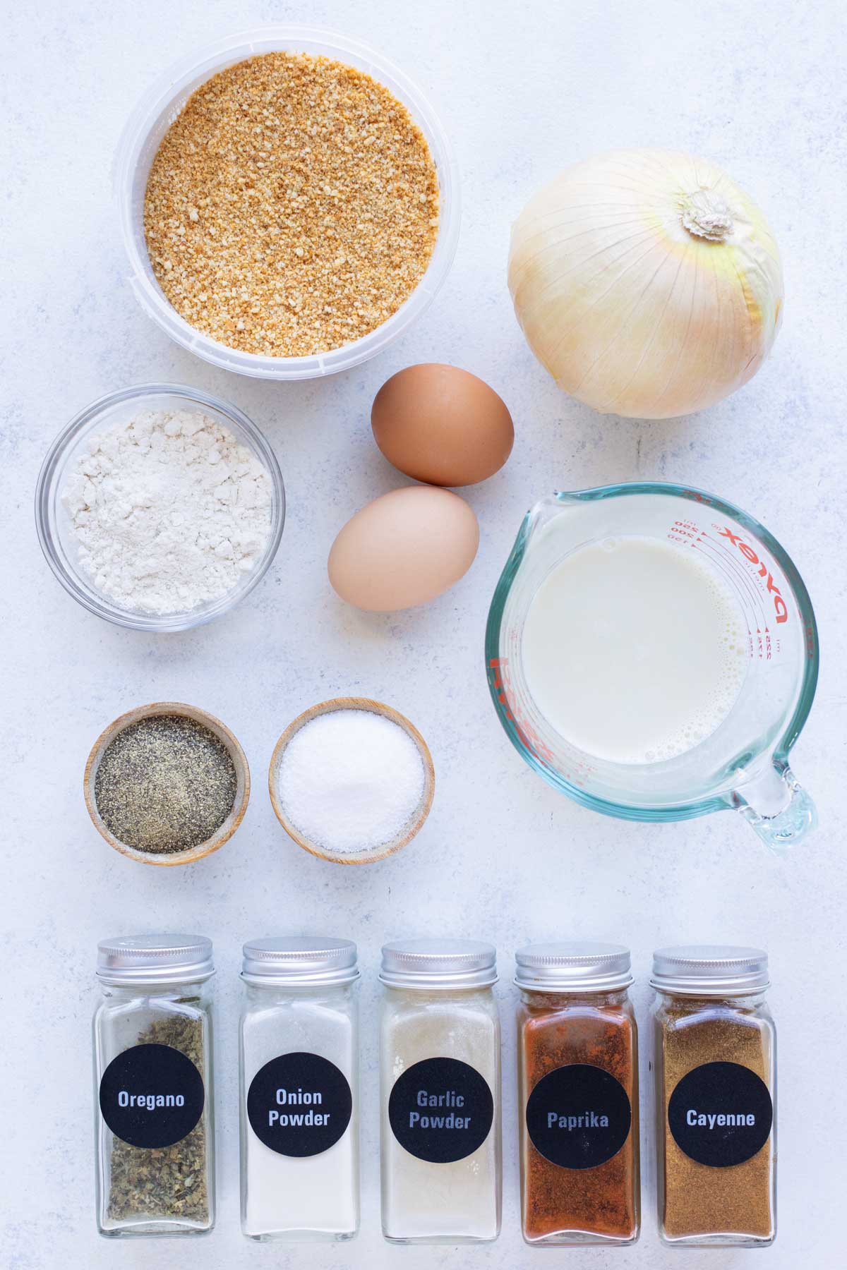 Onion, egg, milk, flour, breadcrumbs, seasonings are the ingredients for this blooming onion.