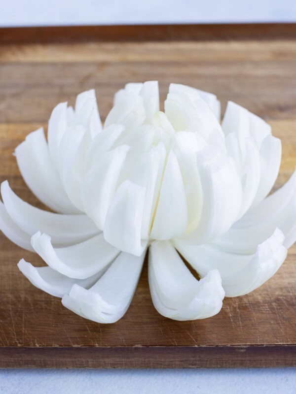 The onion layers are pulled apart so that it looks like a flower.