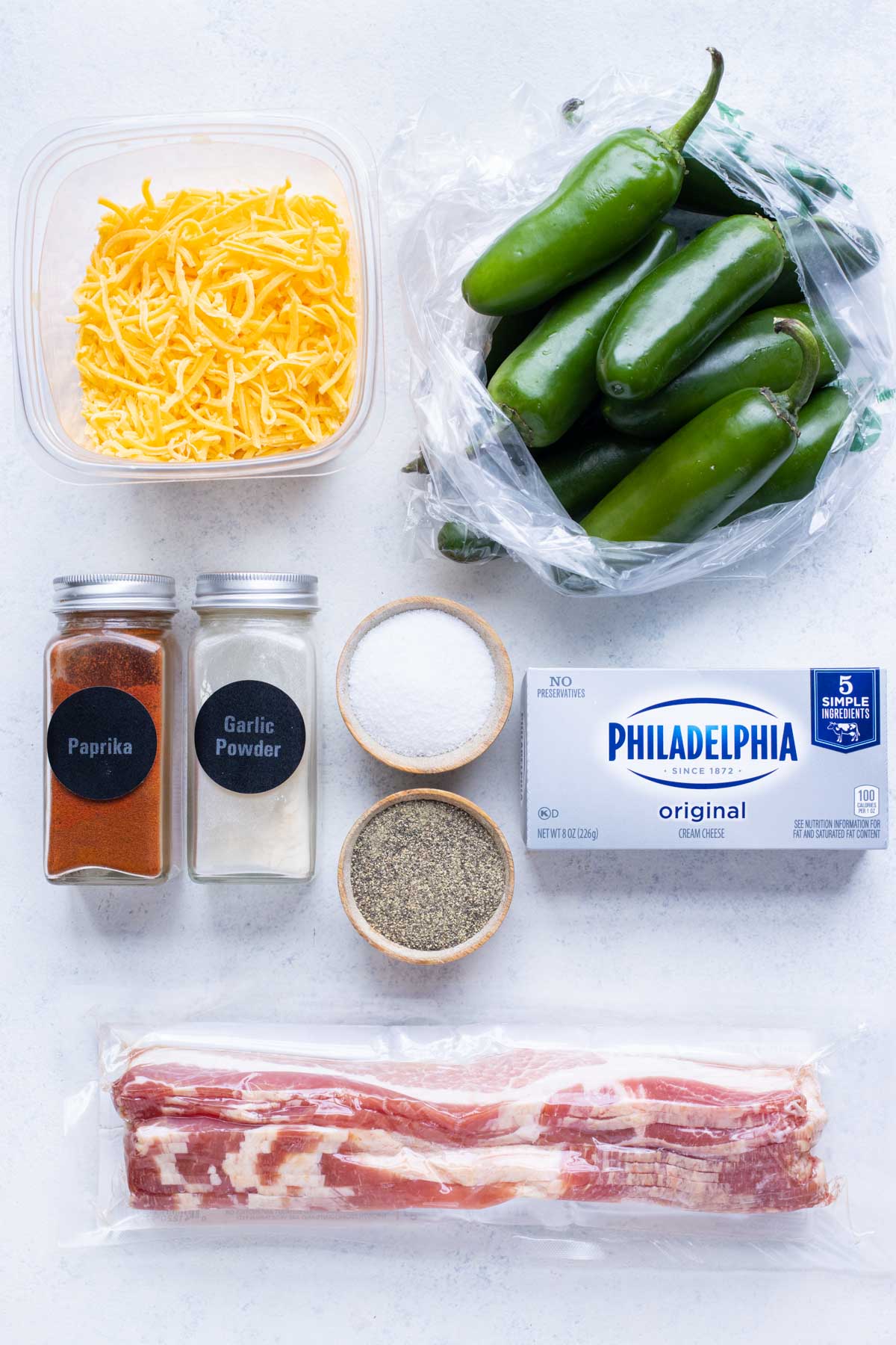 Jalapenos, cheddar cheese, bacon, cream cheese, and seasonings are the ingredients for this recipe.