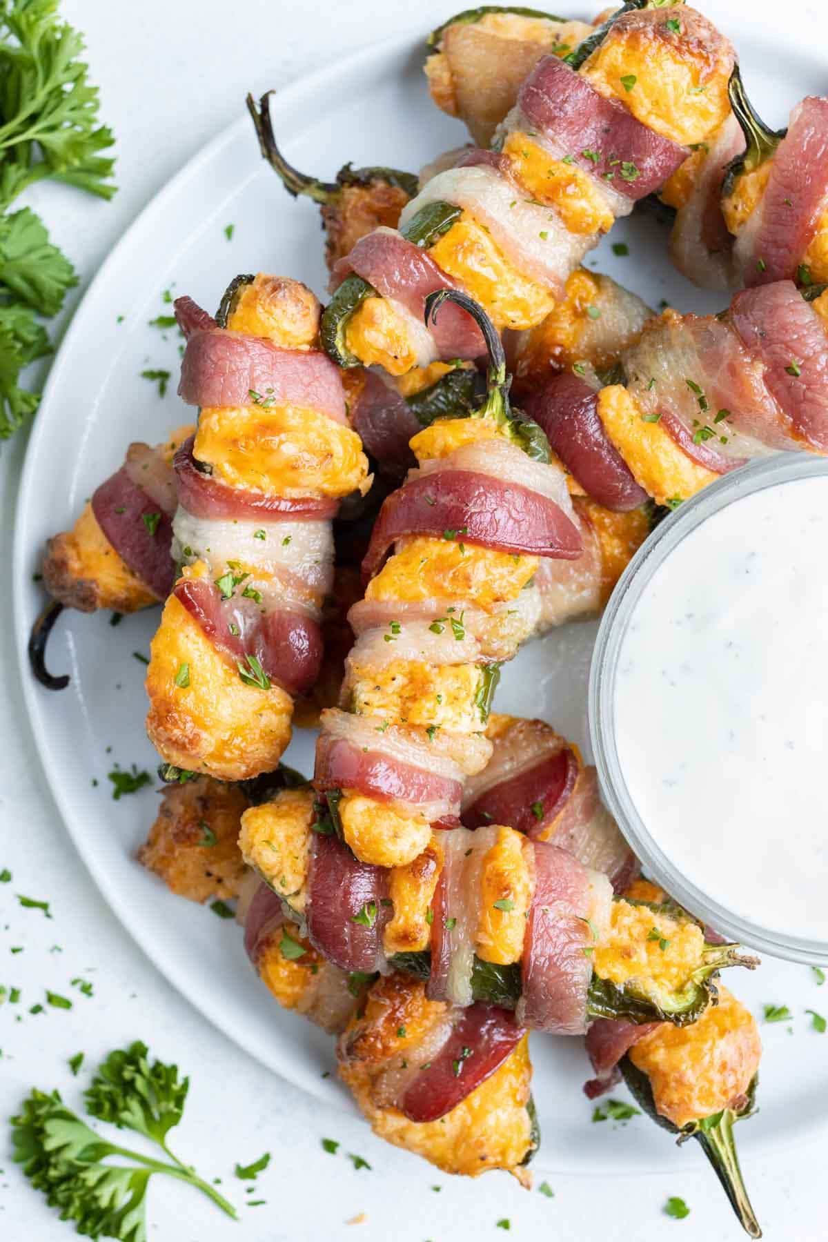 Ranch is served with these easy, low-carb bacon wrapped jalapeno poppers.