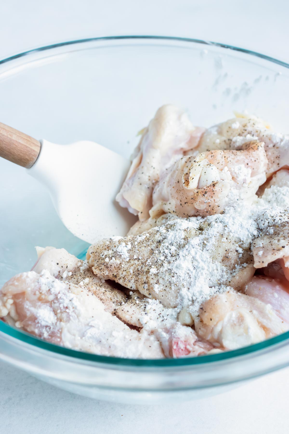 Raw chicken wings are coated in cornstarch for an ultra crispy texture.