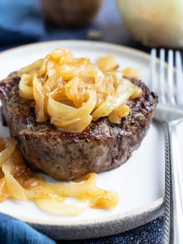 A filet mignon recipe with homemade caramelized onions on top.