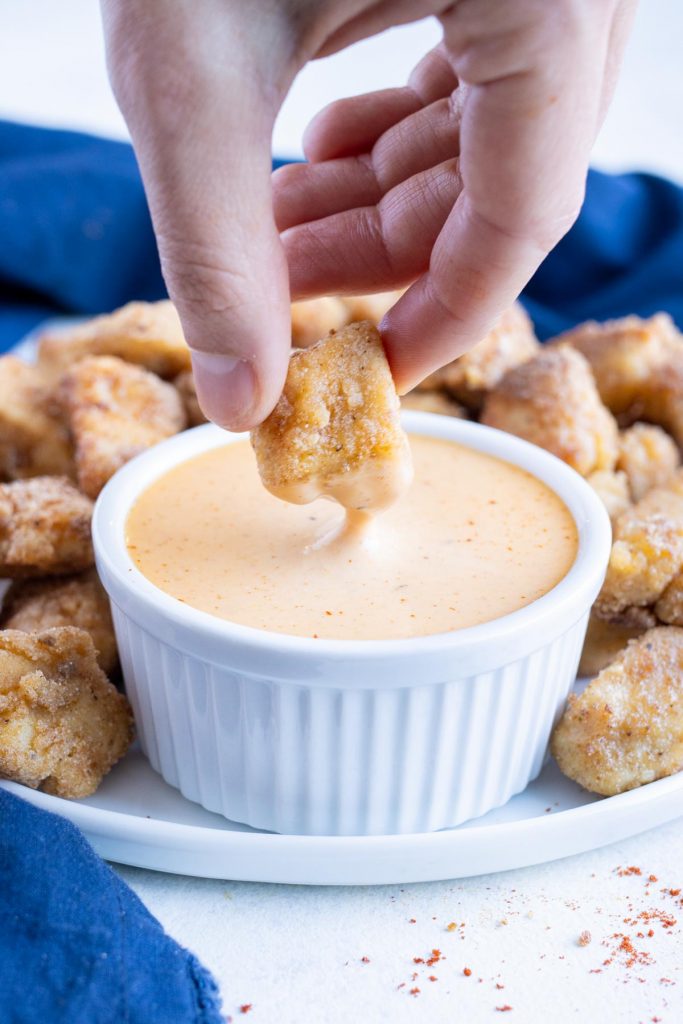 Chicken nuggets are dipped in a copycat Chick-fil-A sauce.